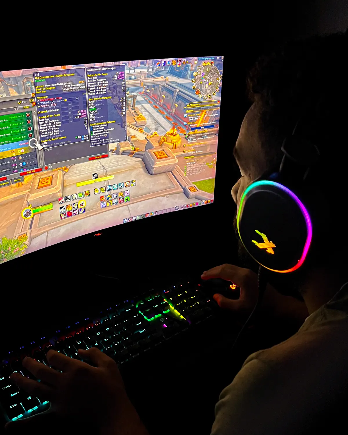 A booster playing Old School RuneScape, hands on the keyboard